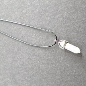 White crystal point pendant necklace on 16-inch faux leather chain